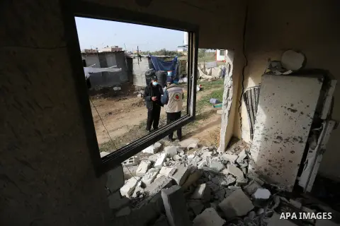 Palestinian Members of the civil defence inspect of a house following Israeli artillery shelling, in the east of Gaza City on December 15, 2020. Late last night, Israeli tanks bombed a Palestinian house in the Gaza Strip...