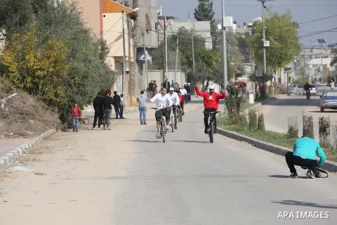 Palestinian amputees take part in Bicycle race during an event in al-Nusairat refugee camp in the central Gaza Strip on December 21, 2020. Sweeping Israeli restrictions on the movement of people and goods, at times exace...