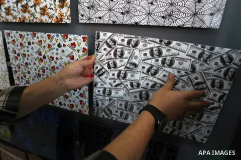 Palestinian graduate Omar Al-Asouli, works in Watercolor print, the first in the Gaza Strip, in Khan Yunis in the southern Gaza Strip on December 22, 2020. The economic repercussions of the coronavirus has led to an incr...