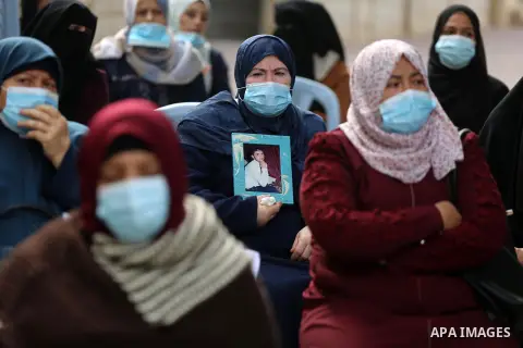 Palestinian families of the martyrs and the wounded, take part in a rally to mark "the Palestinian martyr's day", in Gaza city on January 5, 2021. In January 1965, Ahmad Musa, a Fedayeen fighter with the Fatah faction, r...