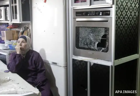 Palestinians inspect the damage in a house after an Israeli military raid in the West Bank city of Jenin on September 4, 2023. A large Israeli army force estimated at more than 40 military vehicles backed by a helicopter...