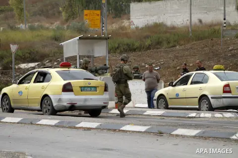 Israeli forces search Palestinian vehicles at the Hawara checkpoint and close the checkpoints south of the West Bank city of Nablus, on September 13, 2023. Two Israelis were injured in a shooting attack yesterday, near t...