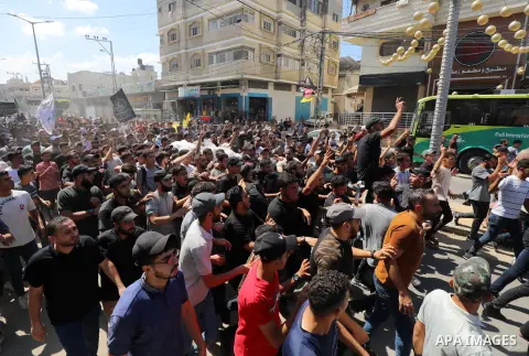 Palestinians carry the body of Mohammed Qadom, who was killed during an explosion near the border fence with Israel, during his funeral in Gaza City on September 14, 2023. Photo by Omar Ashtawy\ apaimages