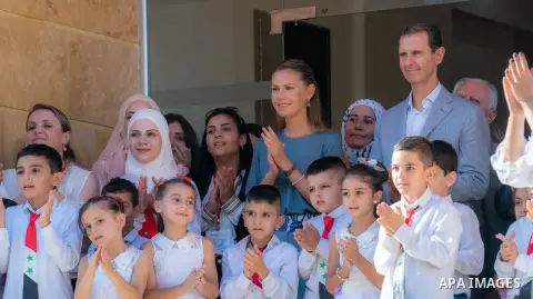 Syria's President Bashar al-Assad and First Lady Asma al-Assad eet with students of Dar Al-Aman School for the Children of Martyrs in Tartous on 28, 2023. Photo by Syrian Presidency\ apaimages