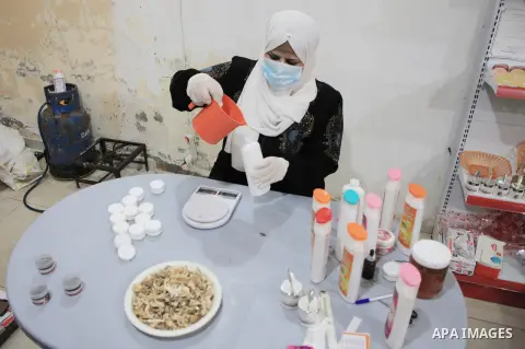 Palestinian Nagham Al Ghattas makes cosmetic products from mushrooms in Gaza city on August 3, 2023. Al Ghattas works on extracting protein from mushrooms and using them in the manufacture of cosmetics and natural health...