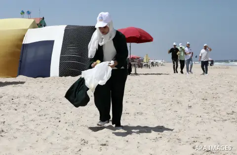 Palestinians take part in the cleaning of the beach of the Mediterranean Sea during the clean up campaign, in Gaza city, on August 05, 2023. Photo by Omar Ashtawy\ apaimages