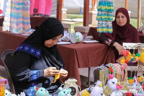 Palestinians attend the Entrepreneurial Business and Products Exhibition in Gaza City on Aug.8, 2023. Photo by Omar Al-Dirawi\ apaimages
