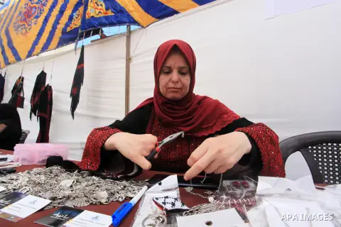 Palestinians attend the Entrepreneurial Business and Products Exhibition in Gaza City on Aug.8, 2023. Photo by Omar Al-Dirawi\ apaimages