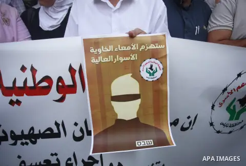 Palestinians take part in a protest in solidarity with prisones held in Israeli Jails in the West Bank city of Nablus on August 15, 2023. According to the latest figures from Addameer, the Palestinian Prisoner Support an...