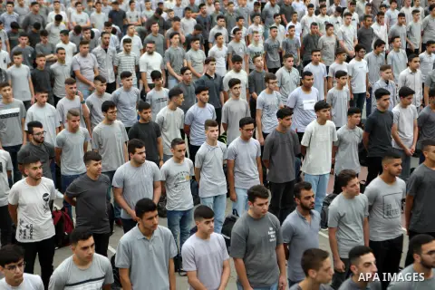 Palestinian students return back to their school in the morning of the first day of the new year study, in the West Bank city of Hebron on August 20, 2023. Photo by Mamoun Wazwaz \ apaimages