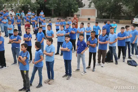 Palestinian students return back to their school in the morning of the first day of the new year study, in the West Bank city of Ramallah on August 20, 2023. Photo by Ahmad Arouri \ apaimages