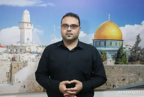 Hamas spokesman Hazem Qassem speaks during an interview with APA agency, in Gaza city on August 24, 2023. 20 Palestinians were arrested from their homes, including ex-Palestinian detainees and members of Hamas and the Is...