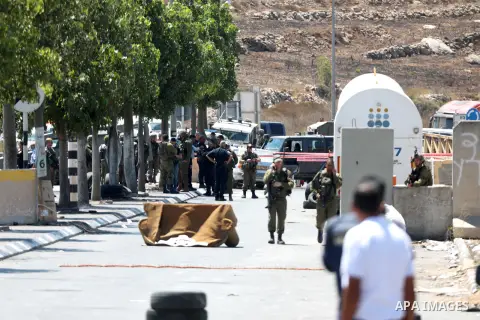 Israeli forces keep guard at the scene of what the Israeli military said is a ramming attack in the West Bank city of Hebron on August 30, 2023. Israeli forces Wednesday shot and injured a Palestinian, south of the West...