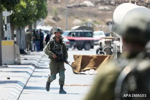 Israeli forces keep guard at the scene of what the Israeli military said is a ramming attack in the West Bank city of Hebron on August 30, 2023. Israeli forces Wednesday shot and injured a Palestinian, south of the West...