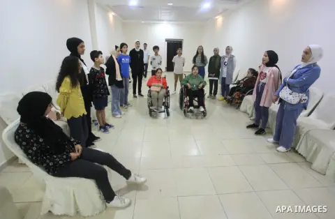 Palestinian with disabilities and their friends learn music during a summer camp in Gaza City on July 29, 2023. Arts camp is an artistic activity that aims to spread the culture of music and knowledge of various musical...