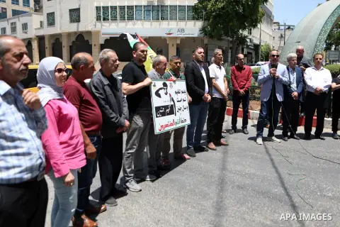 Palestinians shout slogans and hold placards during a demonstration in the West Bank city of Hebron protesting an Israeli military operation in Jenin for the second day, on July 4, 2023. A general strike is observed toda...