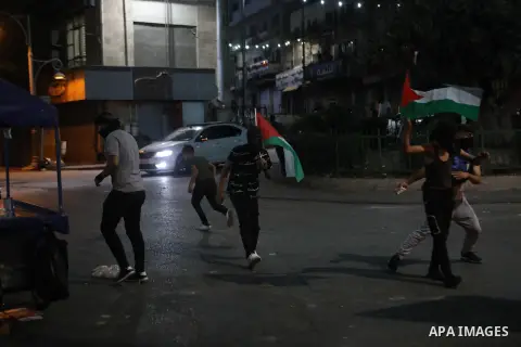 Palestinian protesters clash with Israeli forces following a demonstration in the West Bank city of Hebron protesting an Israeli military operation in Jenin for the second day, on July 4, 2023. Eight Palestinians were sh...