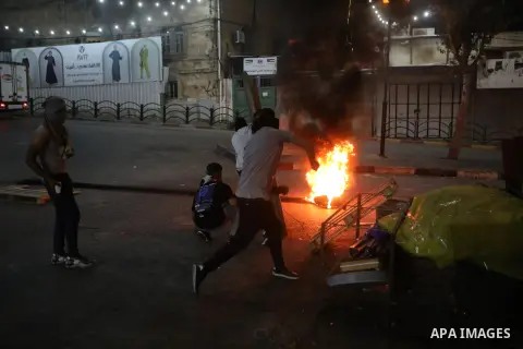 Palestinian protesters clash with Israeli forces following a demonstration in the West Bank city of Hebron protesting an Israeli military operation in Jenin for the second day, on July 4, 2023. Eight Palestinians were sh...