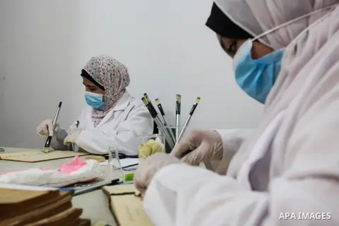 Palestinian researchers repair and and archive the books and ancient manuscripts in Gaza City on July 10, 2023. A group of Palestinian researchers from the ''Eyes on Heritage Foundation'' are restoring and archiving anci...