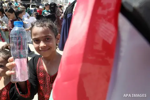 Palestinian children take part in a protest to demand the lifting of the Israeli blockade on Gaza, in the sea port of Gaza city on July 17, 2023. This June marks the 16th anniversary of the blockade Israel imposed on the...