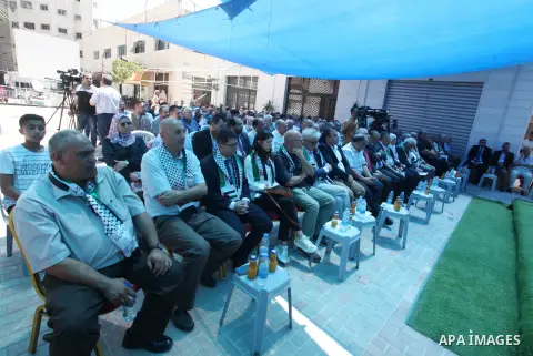 Palestinians participate in the opening ceremony of the Italian Tower rehabilitation project in Gaza city on July 19, 2023. The Italian tower, which was destroyed by Israeli air strike during the Israel-Gaza conflict on...