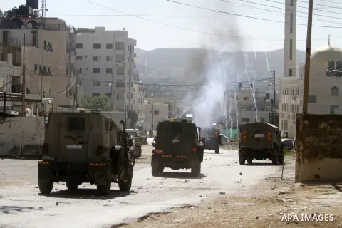 Israeli armoured vehicles advance during a military raid to search for wanted Palestinians at the Askar refugee camp east of Nablus in the West Bank, on July 24, 2023. Israeli forces raided this morning several areas in...