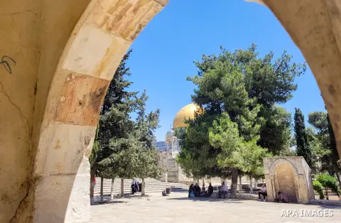 Palestinians walk past the Dome of the Rock mosque at the al-Aqsa mosque compound in Jerusalem, on July 24, 2023. Photo by Mamoun Wazwaz/APAimages