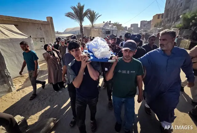 Palestinians mourn the body of eight-year-old Mohammed Saif al-Din al-Shakhriti at Nasser Medical Complex in Khan Younis, southern Gaza Strip, on September 27, 2026, after he was killed by Israeli gunfire while playing i...