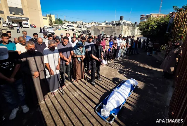 Palestinians mourn the body of eight-year-old Mohammed Saif al-Din al-Shakhriti at Nasser Medical Complex in Khan Younis, southern Gaza Strip, on September 27, 2026, after he was killed by Israeli gunfire while playing i...