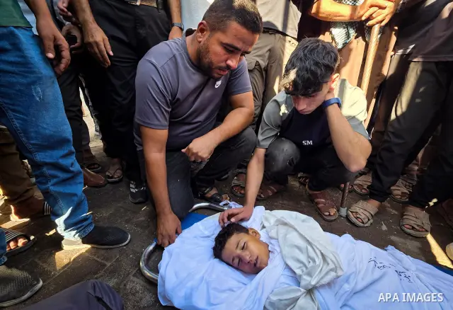 Palestinians mourn the body of eight-year-old Mohammed Saif al-Din al-Shakhriti at Nasser Medical Complex in Khan Younis, southern Gaza Strip, on September 27, 2026, after he was killed by Israeli gunfire while playing i...