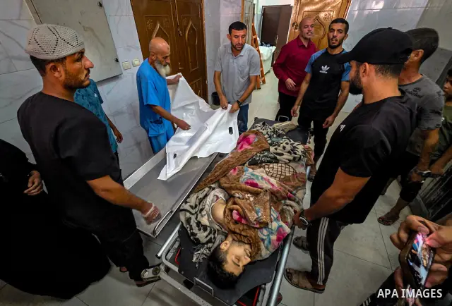 Palestinians carry the body of 28-year-old Oday Adli al-Assar to Nasser Medical Complex in Khan Younis, southern Gaza Strip, on September 27, 2026, after he was killed in an Israeli airstrike that targeted a group of Pal...