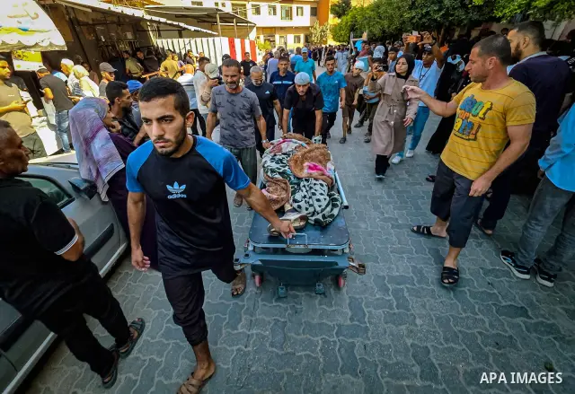 Palestinians carry the body of 28-year-old Oday Adli al-Assar to Nasser Medical Complex in Khan Younis, southern Gaza Strip, on September 27, 2026, after he was killed in an Israeli airstrike that targeted a group of Pal...