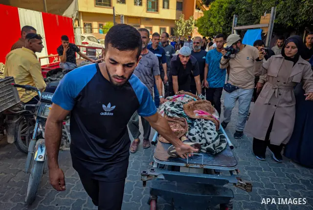 Palestinians carry the body of 28-year-old Oday Adli al-Assar to Nasser Medical Complex in Khan Younis, southern Gaza Strip, on September 27, 2026, after he was killed in an Israeli airstrike that targeted a group of Pal...