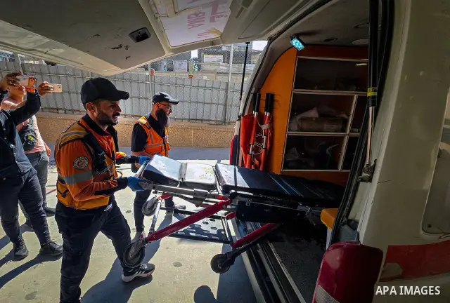 Palestinians carry the body of 28-year-old Oday Adli al-Assar to Nasser Medical Complex in Khan Younis, southern Gaza Strip, on September 27, 2026, after he was killed in an Israeli airstrike that targeted a group of Pal...
