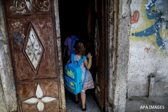 Palestinian visual artist Hala Abu Hamda, 18, paints and colors children’s bags inside her home in the al-Nasr neighborhood of Gaza City on September 27, 2026, as the new academic year begins. Students in the Gaza Strip...