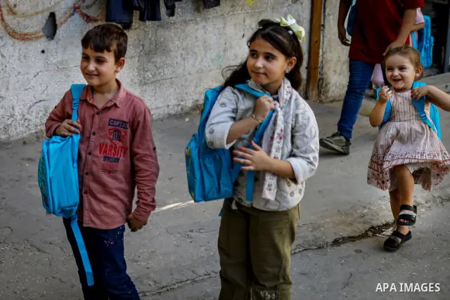 Palestinian visual artist Hala Abu Hamda, 18, paints and colors children’s bags inside her home in the al-Nasr neighborhood of Gaza City on September 27, 2026, as the new academic year begins. Students in the Gaza Strip...