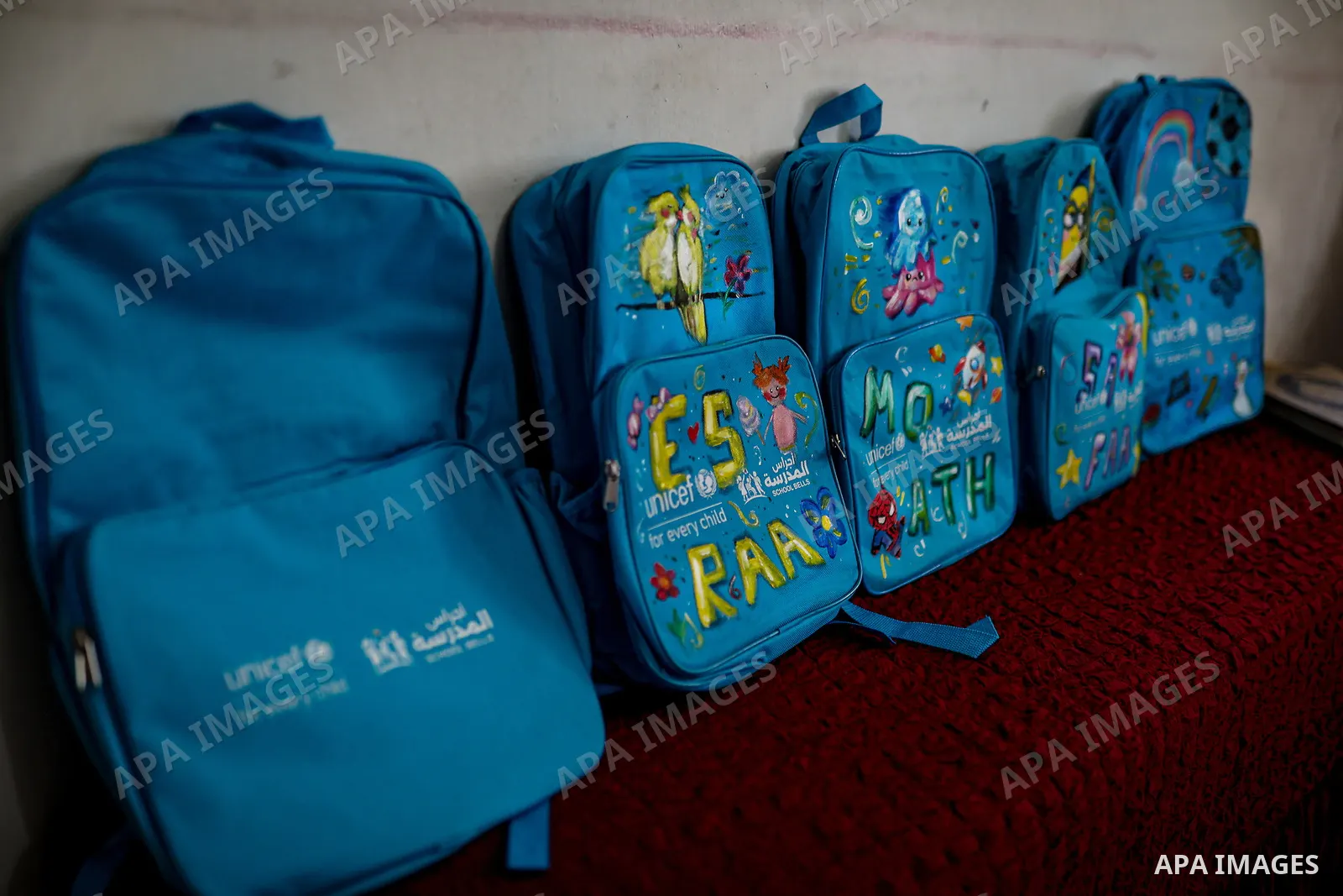 Palestinian visual artist Hala Abu Hamda, 18, paints and colors children’s bags inside her home in the al-Nasr neighborhood of Gaza City on September 27, 2026, as the new academic year begins. Students in the Gaza Strip...