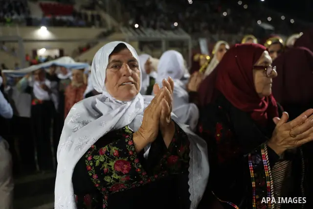Brides and grooms take part in a mass wedding ceremony for 44 couples in Dura, near the West Bank city of Hebron, on September 26, 2026. Thousands of family members, residents and friends attended the celebration to mark...
