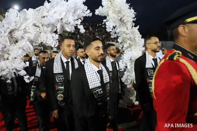 Brides and grooms take part in a mass wedding ceremony for 44 couples in Dura, near the West Bank city of Hebron, on September 26, 2026. Thousands of family members, residents and friends attended the celebration to mark...