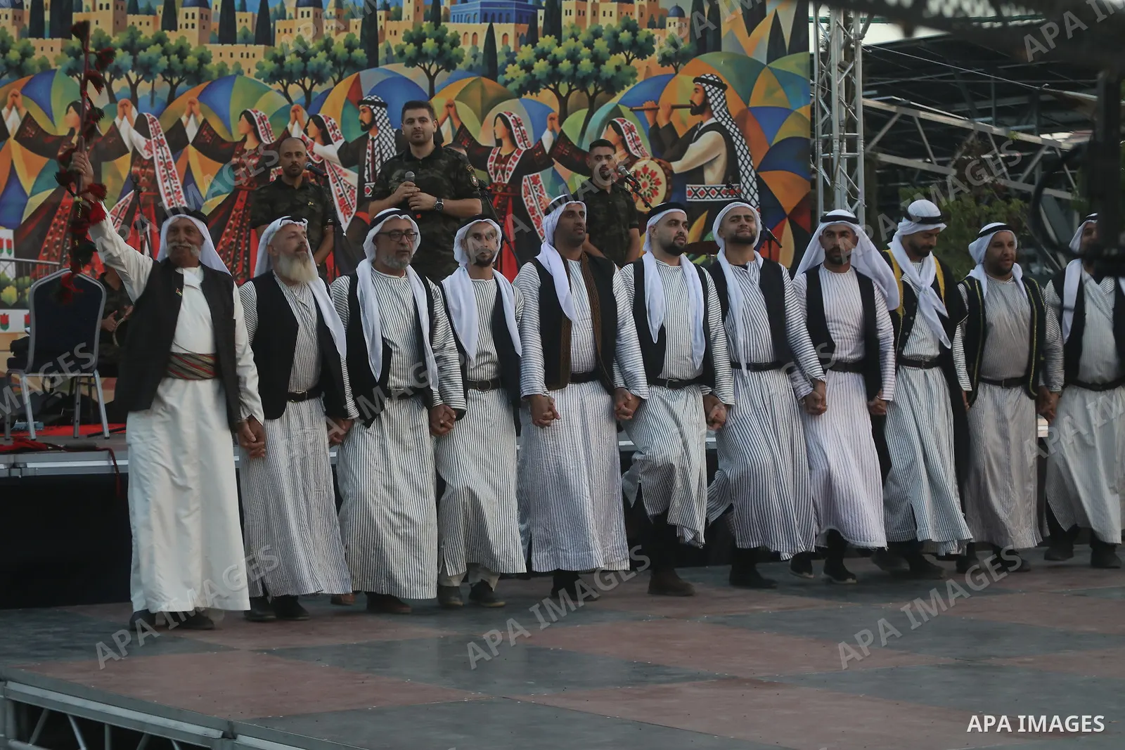Brides and grooms take part in a mass wedding ceremony for 44 couples in Dura, near the West Bank city of Hebron, on September 26, 2026. Thousands of family members, residents and friends attended the celebration to mark...
