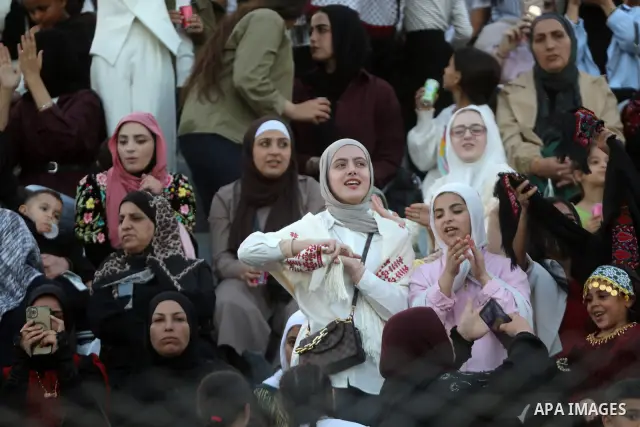 Brides and grooms take part in a mass wedding ceremony for 44 couples in Dura, near the West Bank city of Hebron, on September 26, 2026. Thousands of family members, residents and friends attended the celebration to mark...