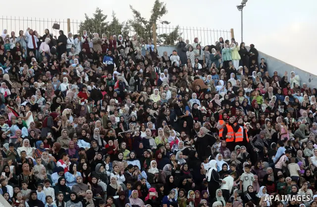 Brides and grooms take part in a mass wedding ceremony for 44 couples in Dura, near the West Bank city of Hebron, on September 26, 2026. Thousands of family members, residents and friends attended the celebration to mark...