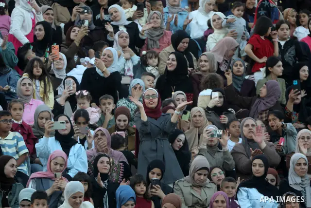Brides and grooms take part in a mass wedding ceremony for 44 couples in Dura, near the West Bank city of Hebron, on September 26, 2026. Thousands of family members, residents and friends attended the celebration to mark...