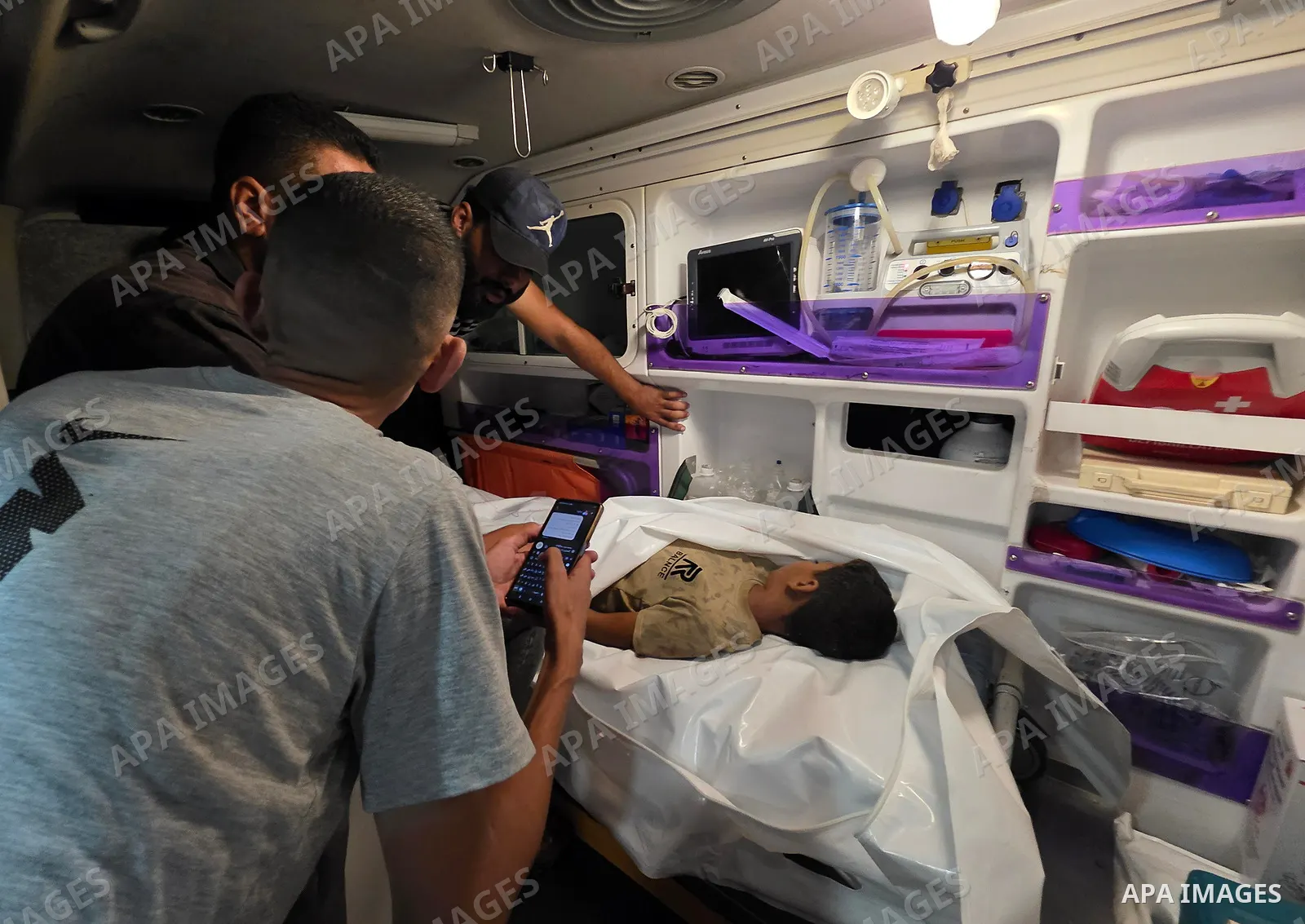 Medics carry the body of eight-year-old Mohammed Seif al-Din al-Shukhriti to Nasser Medical Complex in Khan Younis, southern Gaza Strip, on September 26, 2026, after he was killed by Israeli gunfire while playing outside...
