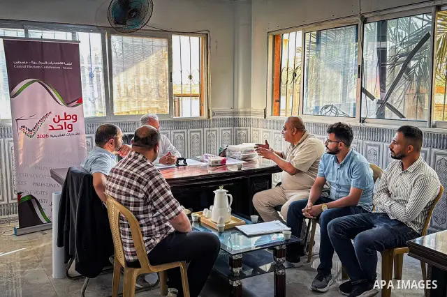 Palestinians submit nomination applications for their electoral lists for the 2026 legislative elections at the Central Elections Commission office in Deir el-Balah, central Gaza Strip, on September 26, 2026. The commiss...
