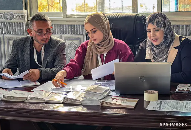 Palestinians submit nomination applications for their electoral lists for the 2026 legislative elections at the Central Elections Commission office in Deir el-Balah, central Gaza Strip, on September 26, 2026. The commiss...