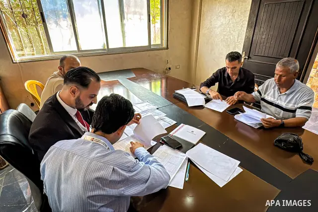 Palestinians submit nomination applications for their electoral lists for the 2026 legislative elections at the Central Elections Commission office in Deir el-Balah, central Gaza Strip, on September 26, 2026. The commiss...