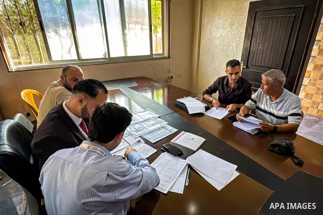 Palestinians submit nomination applications for their electoral lists for the 2026 legislative elections at the Central Elections Commission office in Deir el-Balah, central Gaza Strip, on September 26, 2026. The commiss...