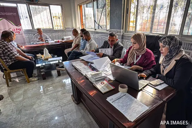 Palestinians submit nomination applications for their electoral lists for the 2026 legislative elections at the Central Elections Commission office in Deir el-Balah, central Gaza Strip, on September 26, 2026. The commiss...