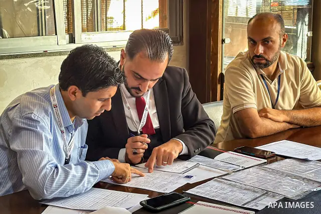 Palestinians submit nomination applications for their electoral lists for the 2026 legislative elections at the Central Elections Commission office in Deir el-Balah, central Gaza Strip, on September 26, 2026. The commiss...